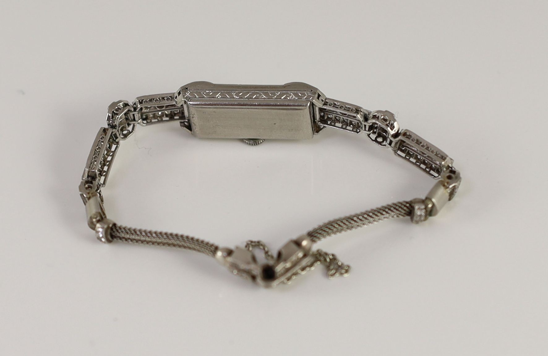 A lady's mid 20th century platinum and diamond set manual wind cocktail watch, retailed by Asprey, approx. 16cm, gross weight 23.2 grams.
